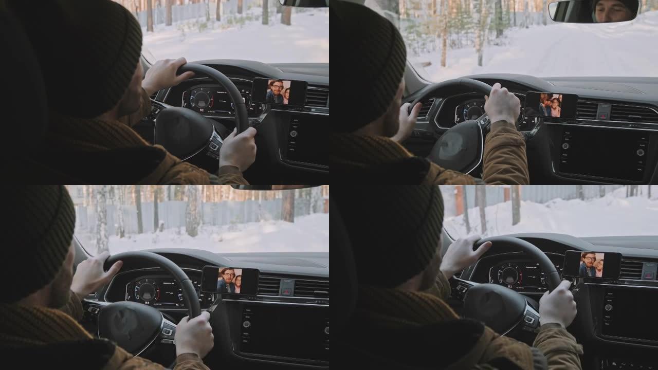 男子在冬天开车，在视频通话中聊天