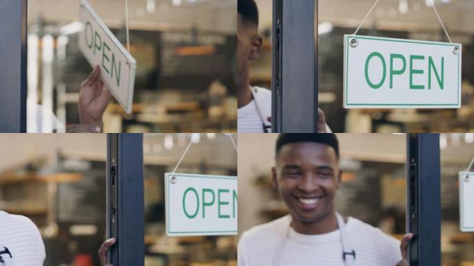 一名年轻人在面包店悬挂开放标志的4k录像