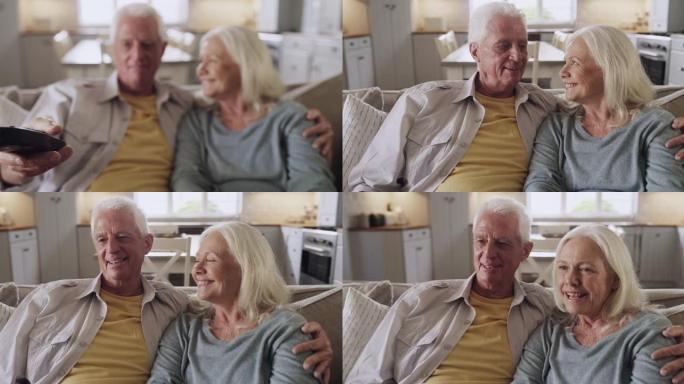 一对老年夫妇使用遥控器坐在家里的4k录像
