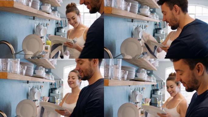 一对年轻夫妇在家一起洗碗的4k录像