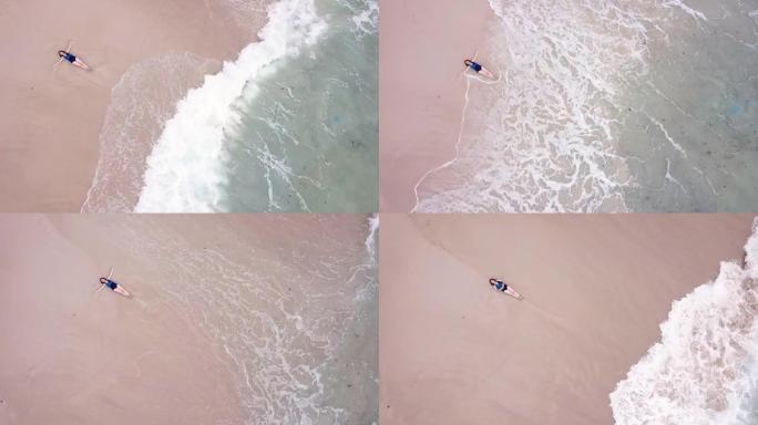 女人在海上白色沙滩上行走并快乐，空中射击