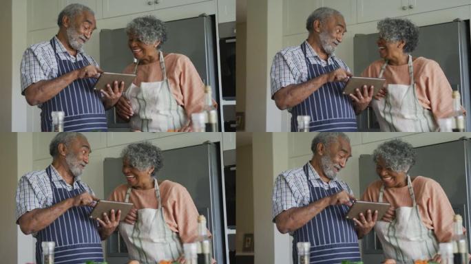 快乐的非洲裔美国老年夫妇一起烹饪动画，使用平板电脑