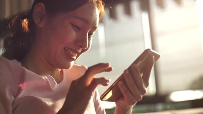 亚洲女性使用手机进行社交媒体