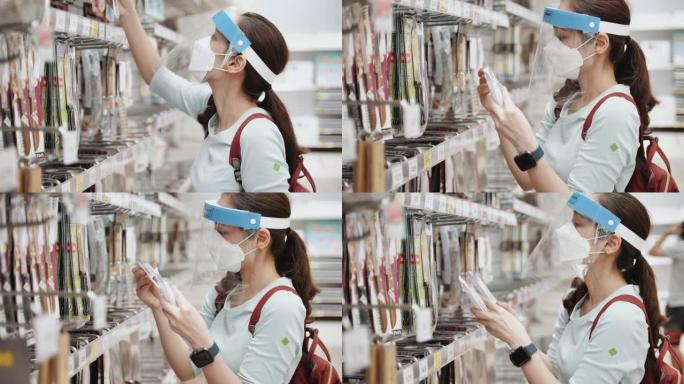 亚洲女子戴口罩在超级市场购物