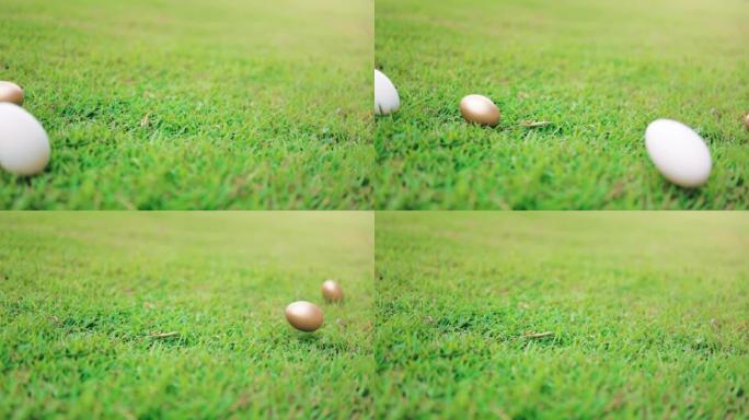 复活节彩蛋在绿草地上滚落