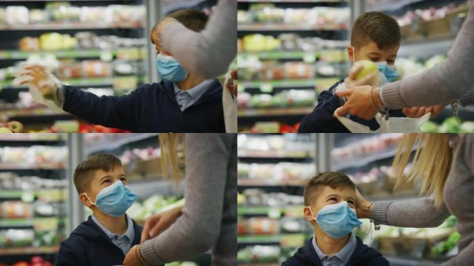 母子俩戴着医用口罩的真实特写镜头，以保护自己免受疾病的侵害，在超市一起购物。