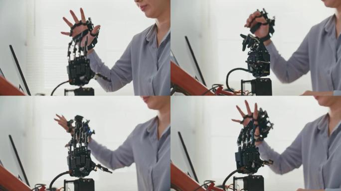 在研究实验室中享受开发工程乐趣的工程师特写未来主义假肢机器人手臂