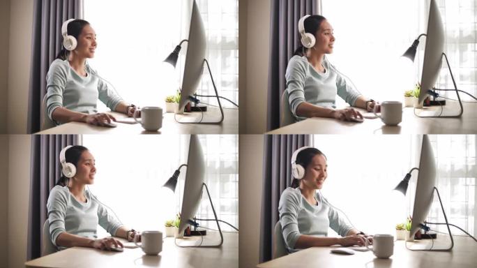 亚洲妇女在家中使用计算机