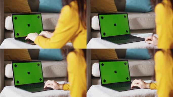 在家工作-笔记本电脑上的色度键绿色屏幕