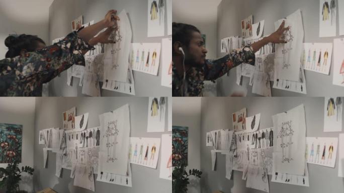 印度时装设计师将素描贴在墙上