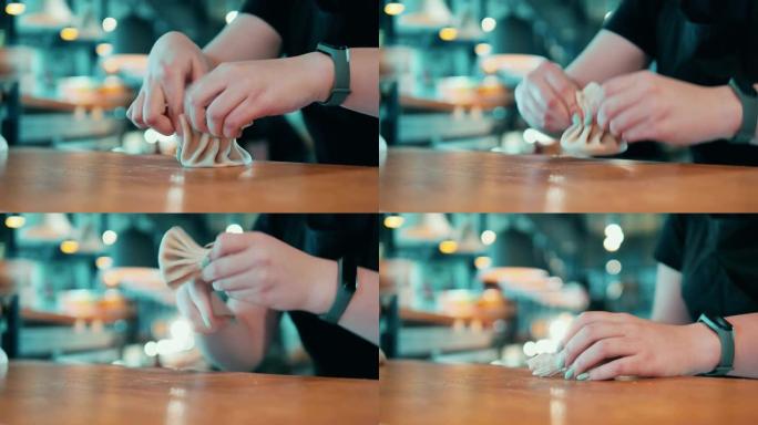 餐馆工人塑造饺子的特写镜头