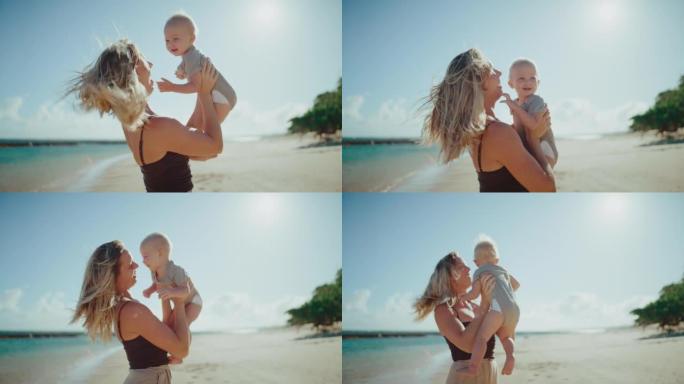 母亲和年幼的婴儿海边沙滩嬉戏