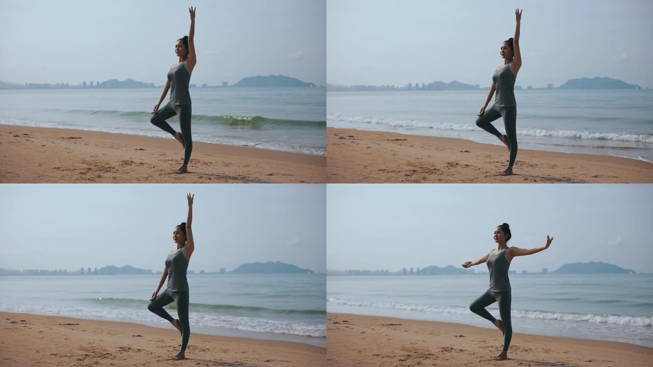 女人在海滩上做瑜伽