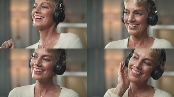 4k视频片段，一名高级女子在家中戴着耳机享受生活