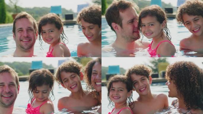 相机追踪暑假在游泳池里放松的多种族家庭的面孔 -- 慢动作拍摄