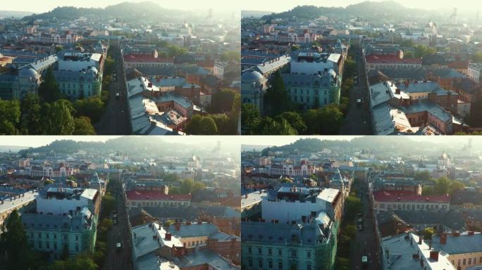 夏季日出时，无人机在乌克兰欧洲老城利沃夫 (Lviv) 的美丽街道和历史建筑上缓慢飞行。