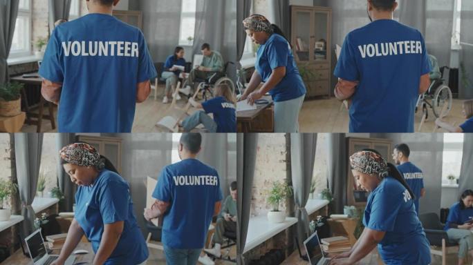 志愿者携带纸板箱慈善服务社区援助医护护理