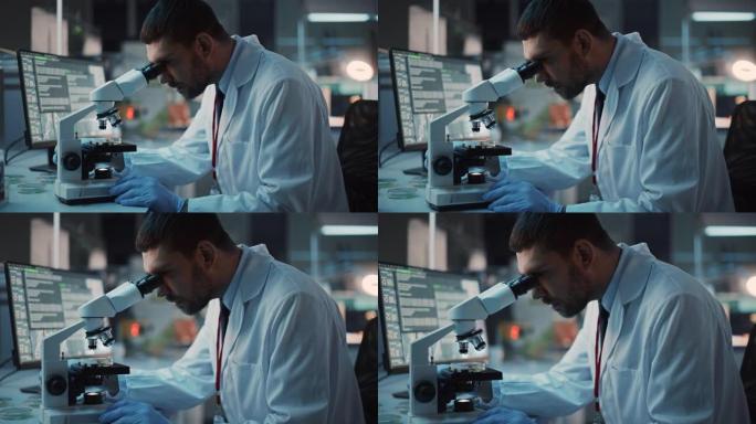 医学研究科学家在生物应用科学实验室在数字显微镜下进行DNA实验。穿着白大褂的白人实验室工程师，从事疫