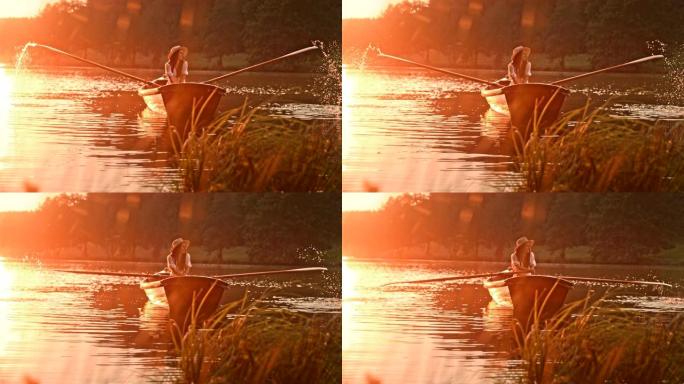 时间扭曲效应年轻女子喜欢在日落时划过湖面
