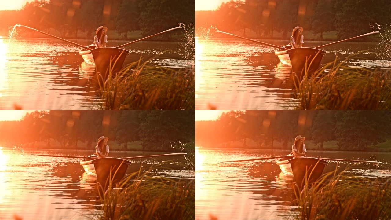 时间扭曲效应年轻女子喜欢在日落时划过湖面