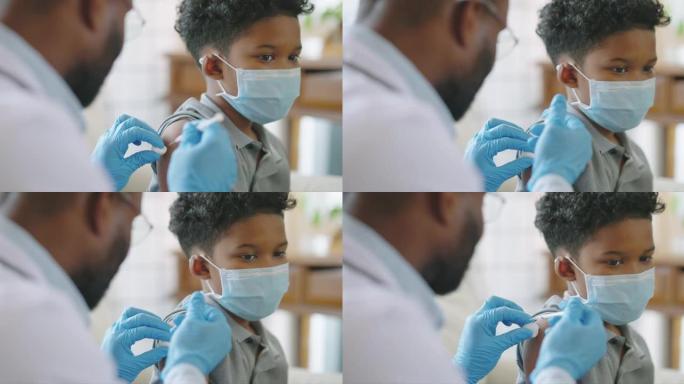 非裔美国人的男性医生或护士在医院或家庭为9岁儿童的肩膀注射疫苗或疫苗，并一起接种疫苗和预防冠状病毒大