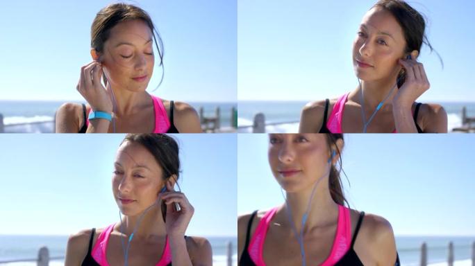 4k视频片段，一名妇女在跑步时使用耳塞听音乐