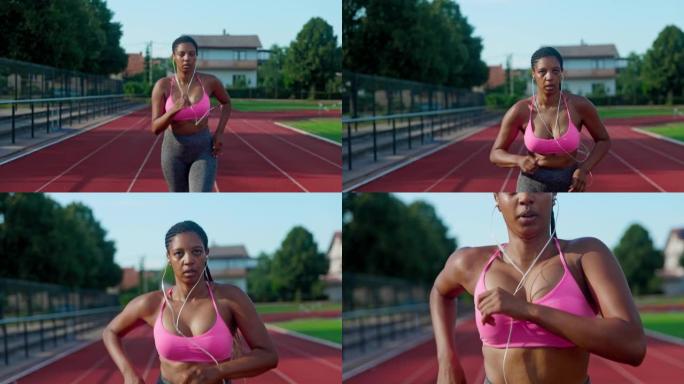 SLO MO非洲裔美国运动员在跑道上跑步时听音乐
