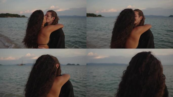 情侣在海滩上接吻亲吻情人节七夕