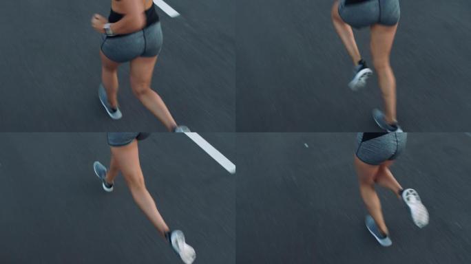 健身，女人和腿在街上跑步，参加比赛，马拉松或训练健康的生活方式。健康，有氧运动和跑步者女孩在道路上锻