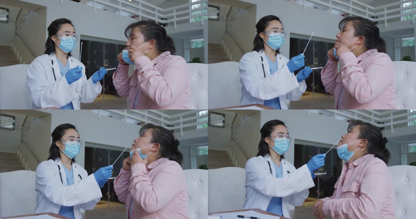 亚洲女护士戴口罩给住院女病人做covid拭子测试