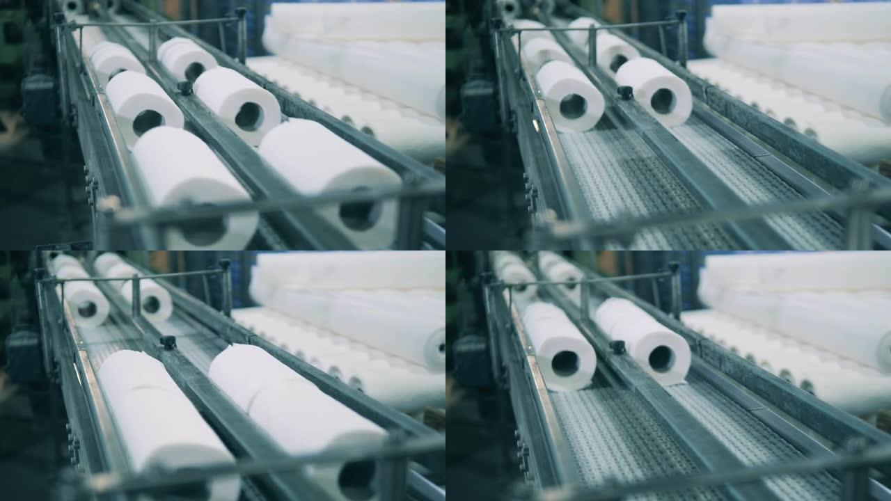 纸厂的纸巾卷沿着传送带移动