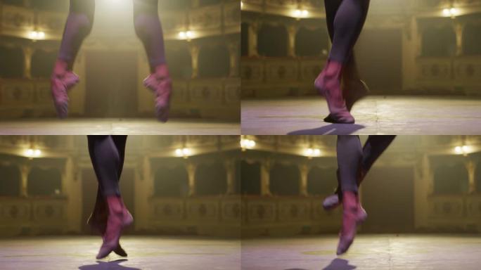 一位年轻的运动古典芭蕾舞男舞者的脚的电影特写镜头，同时在表演开始前在经典的剧院舞台上表演舞蹈，并带有