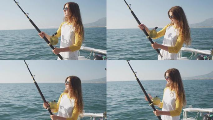 一个十几岁的高加索女孩在船上钓鱼的侧视图