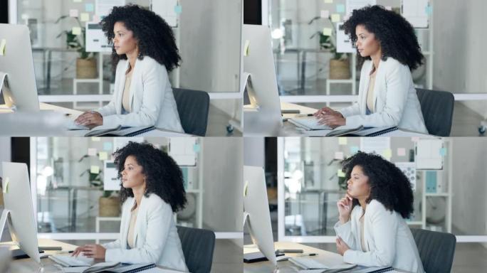 女商人独自在办公室工作时打字电子邮件，看上去很困惑，并在台式计算机上思考。女性企业专业人士、助理或秘