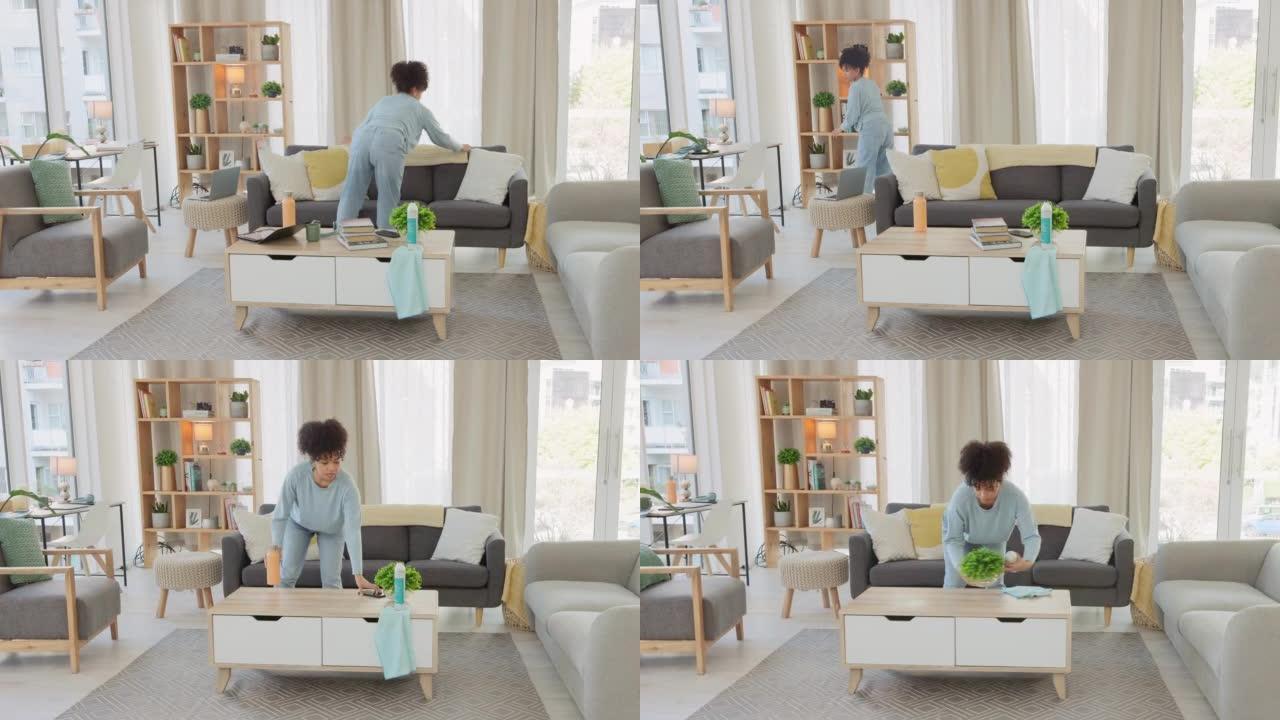 非裔美国女性春季大扫除，在完成家务后坐着休息。一名黑人妇女在打扫公寓后在沙发上放松的时间流逝。