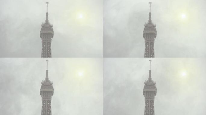 法国巴黎埃菲尔铁塔和烟雾的顶部。
