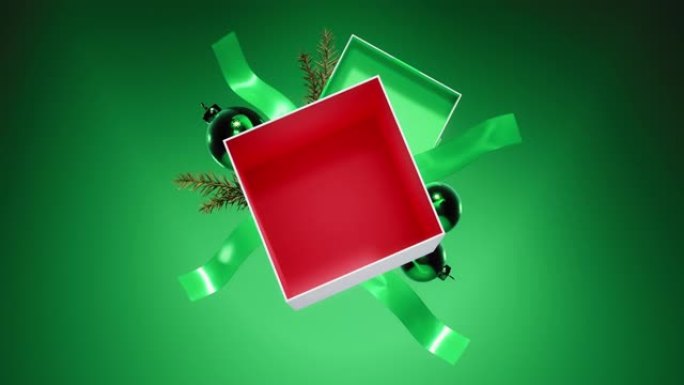 绿色背景上的空红色圣诞礼盒