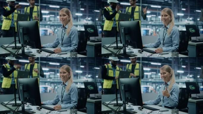 汽车厂办公室: 在台式电脑上工作的女工程师的肖像，微笑着竖起大拇指的手势。自动化机器人手臂装配线制造