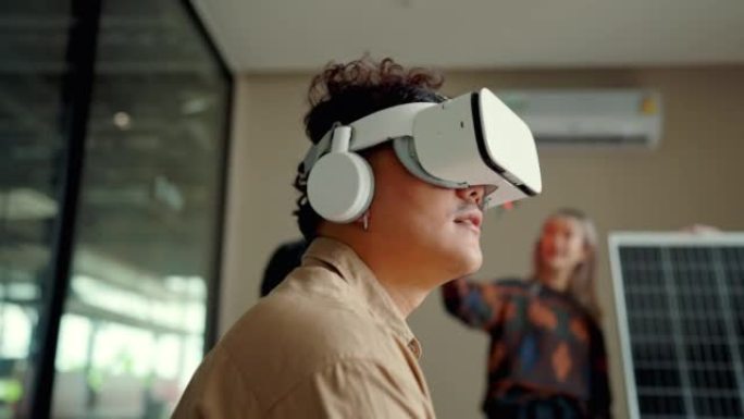 戴虚拟现实眼镜的亚洲未来派男子工程师。