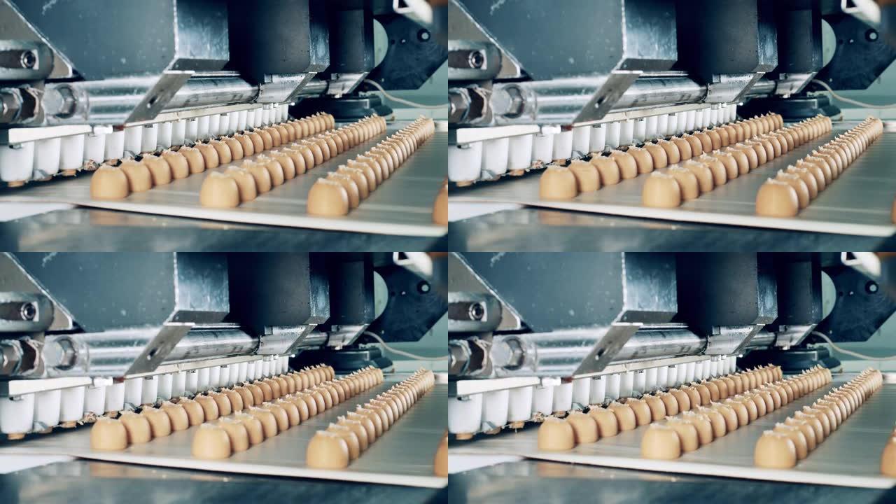 糖果机正在生产糖果并运输它们