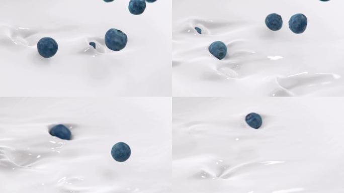 蓝莓以4k超慢动作溅入液体奶油中