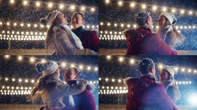 浪漫的冬天下雪的夜晚: 滑冰夫妇在溜冰场上玩得开心，旋转和跳舞。户外双人滑冰。年轻人的肖像，恋爱中的