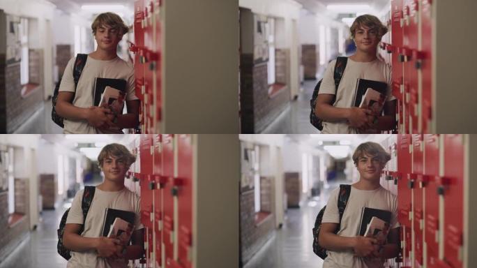 4k视频片段，一个十几岁的男孩站在高中的储物柜旁边
