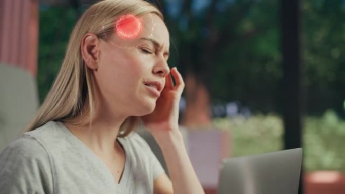 VFX头痛动画: 特写一名女性在笔记本电脑上工作，经历不适和偏头痛。增强现实数字图形显示出突然的严重