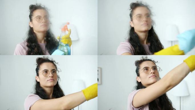 女清洁工的肖像转向相机在家里的室内喷水和洗涤