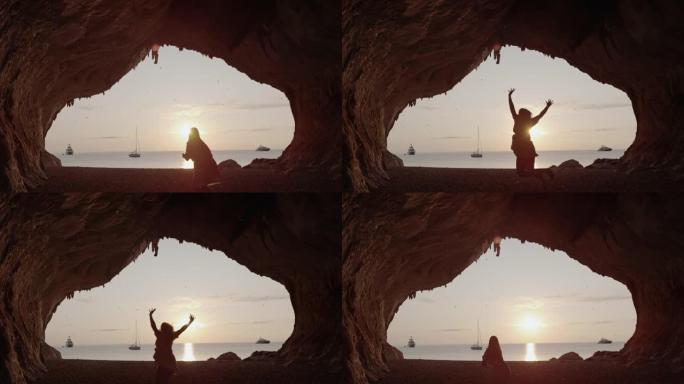 一个女人在海滩上跳跃的超级SLO MO视图，Cala Luna，撒丁岛。意大利。
