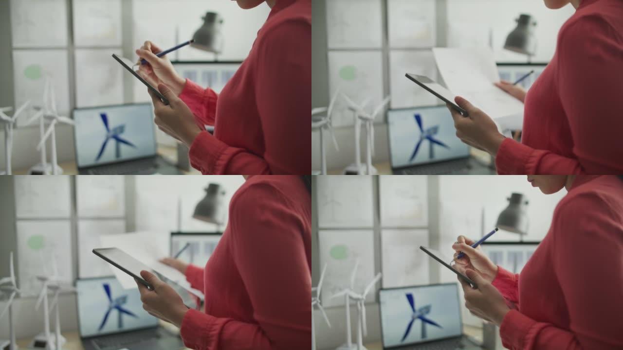 使用数字铅笔和图形平板电脑的女人的手