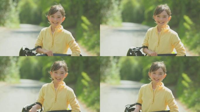 带着滑板的微笑女孩沿着乡间小路行走的肖像