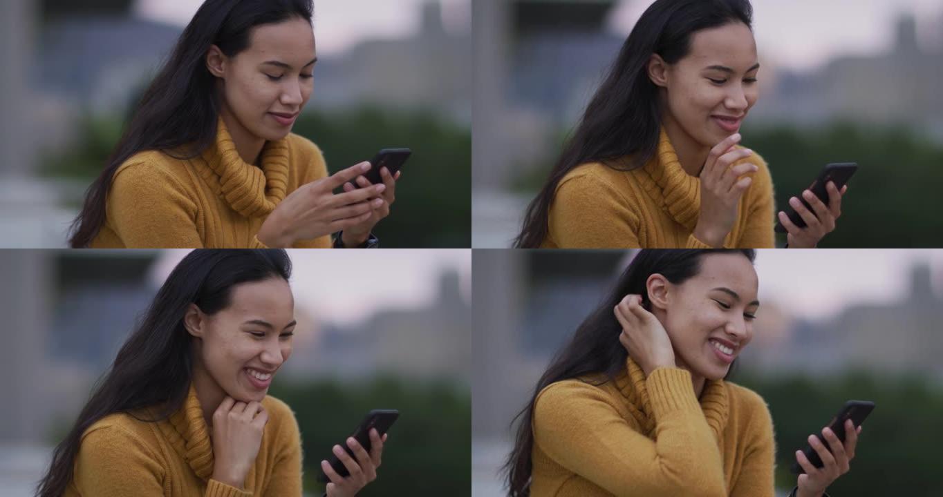 亚洲妇女使用智能手机和微笑