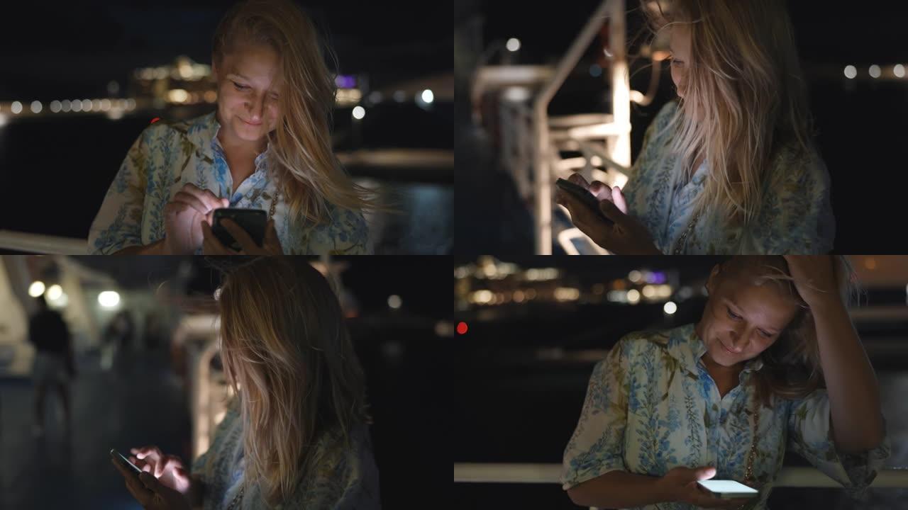 晚上使用智能手机的女人的慢动作视图。